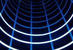Blue-lit tunnel with geometric light patterns, used to represent experimental motion and immersive spatial interaction.